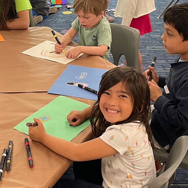 Photo of a young girl smiling at after school program
