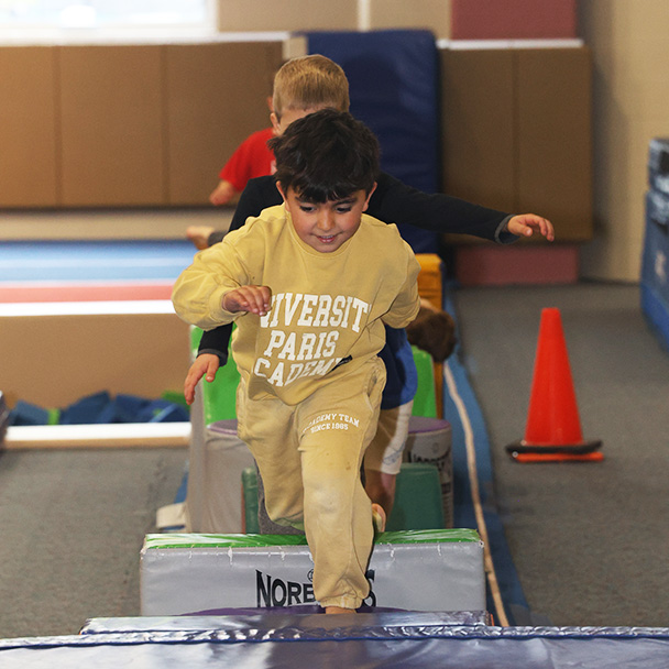 Young boys in gymnastics class