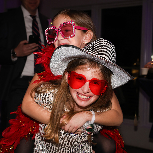 Photo of two young girls smiling and having fun at the Royal Ball